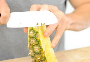 Here cutting a pineapple with ceramic knife